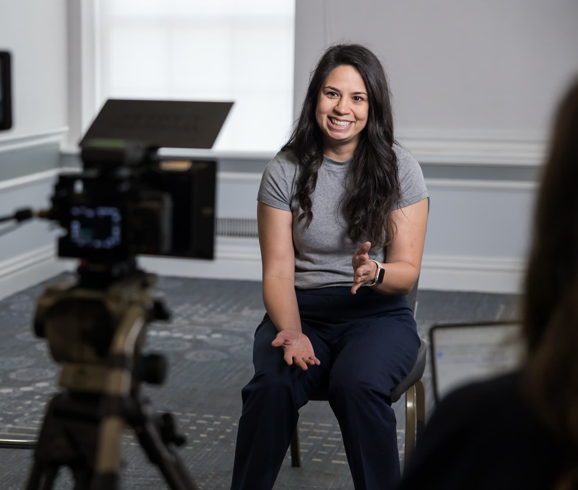 Young woman speaking into camera about heart health